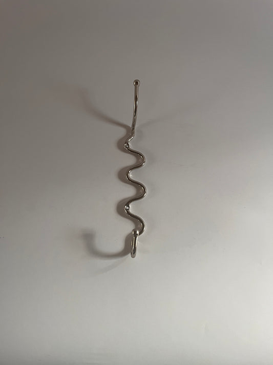 Wiggle hook in nickel plated brass similar to a squiggle hook or curvature hook 